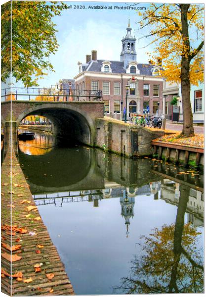 Autumnal canal scene in Edam, Netherlands. Canvas Print by David Birchall
