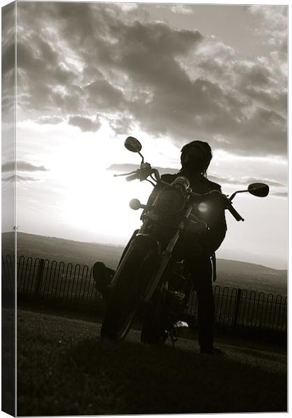 biker at sun set Canvas Print by tom crockford