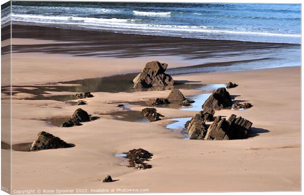 Puddles and Rocks at Putsborough Sands Canvas Print by Rosie Spooner