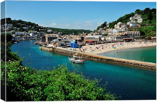 A boat head back up the River Looe in Cornwall Canvas Print by Rosie Spooner