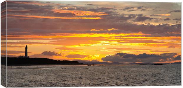 Late evening sunset at Lossiemouth lighthouse Canvas Print by Lloyd Fudge