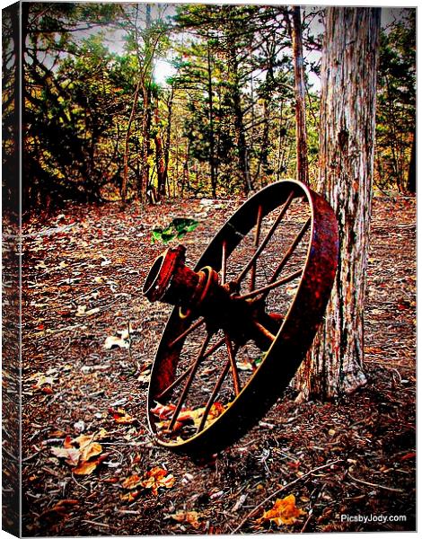 Rusty Wheel Canvas Print by Pics by Jody Adams