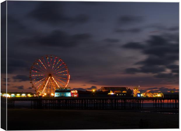 Blackpool South Pier at sunset Canvas Print by Paul Watson
