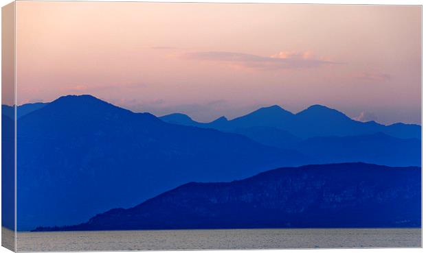 Lake Garda at sun down Canvas Print by Peter Lennon
