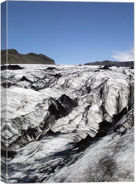 Volcanic ash on glacier. Canvas Print by Kay Gorzko