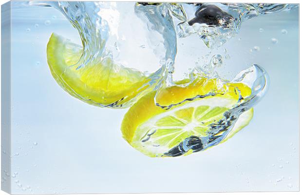 lemon splash Canvas Print by Silvio Schoisswohl
