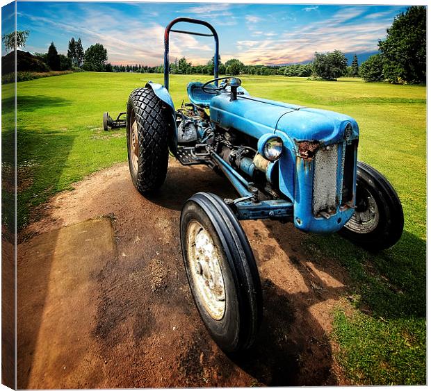 Nostalgic Charm of a Blue Tractor Canvas Print by P D