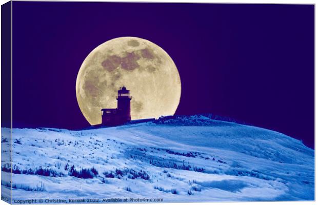 Big Moon in the Snow Silhouetting Lighthouse Canvas Print by Christine Kerioak