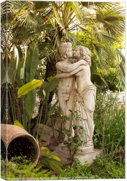 Statue of Lovers Kissing in Garden Canvas Print by Christine Kerioak