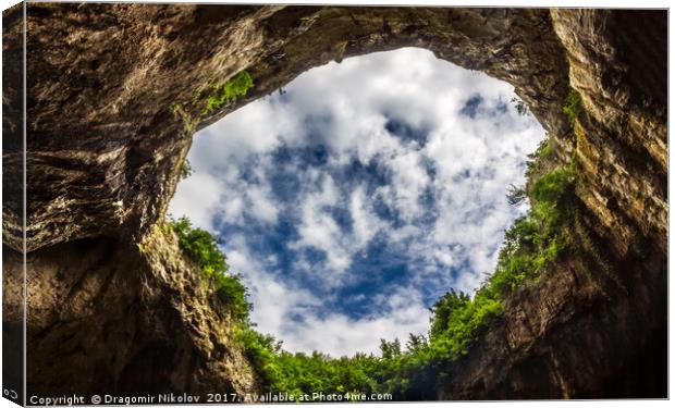 Sky through under the cave Canvas Print by Dragomir Nikolov