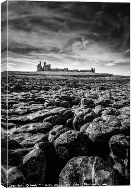 Dunstanburgh Castle at low tide Canvas Print by Andy McGarry