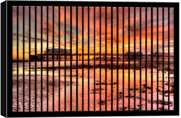 Worthing Pier Sunset Canvas Print by Malcolm McHugh