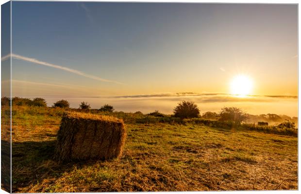 Hay Bale Sunrise Canvas Print by Malcolm McHugh