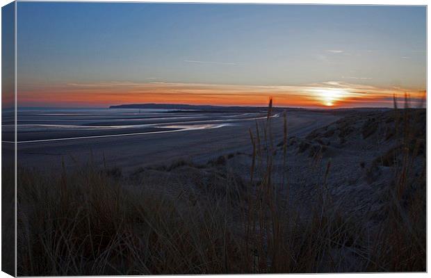  Sun going down on Camber beach Canvas Print by Stephen Prosser