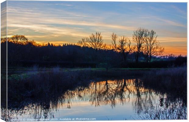 Sunset over the river Canvas Print by Stephen Prosser