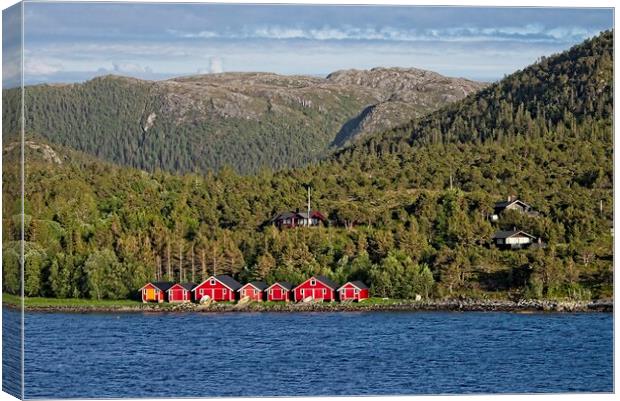 Boathouses in Norway Canvas Print by Martyn Arnold