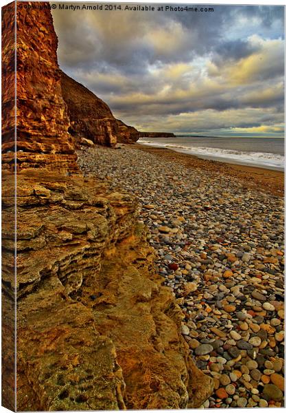 Rocks and Ciffs on Seashore Canvas Print by Martyn Arnold