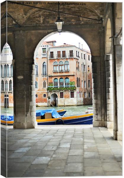 Venice Boat through Arches Canvas Print by Jean Gill