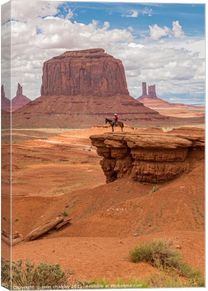  Monument Valley - Lone Horseman Canvas Print by colin chalkley