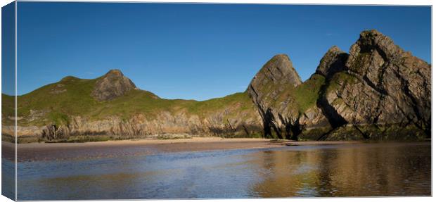 The rugged Three Cliffs Bay Canvas Print by Leighton Collins
