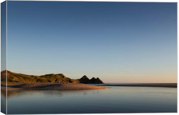 Blue sky at Three Cliffs Bay  Canvas Print by Leighton Collins