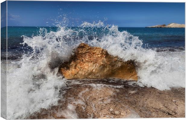 Crashing wave on a Greek beach Canvas Print by Leighton Collins