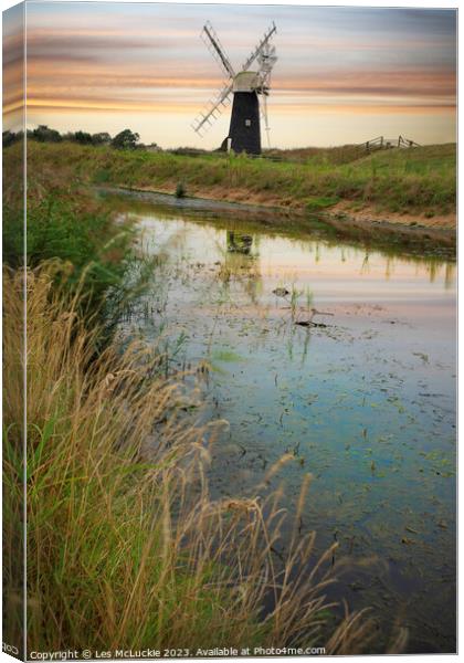 Windmill reflections Canvas Print by Les McLuckie