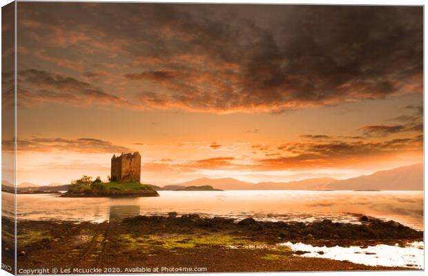 Majestic Sunset over Castle Stalker Scotland Canvas Print by Les McLuckie