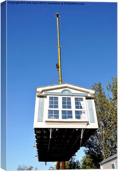 A large caravan lifted from its base, on the crane Canvas Print by Frank Irwin