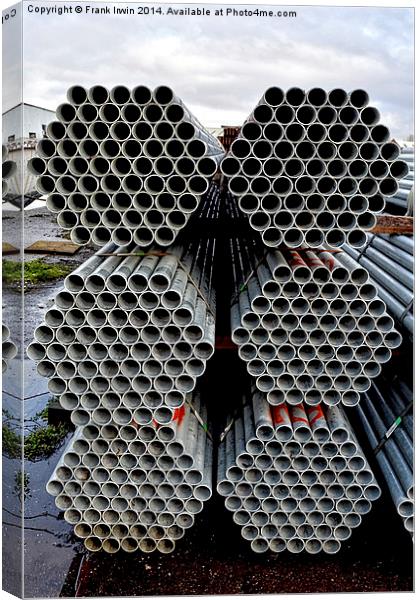 Steel tubes stacked and offloaded, ready for deliv Canvas Print by Frank Irwin