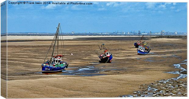 A row of small boats beached awaiting the incoming Canvas Print by Frank Irwin