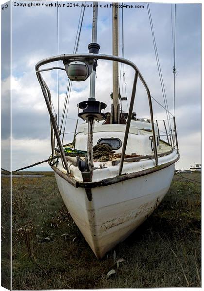  A slightly battered yachy lies on Heswall Beach,  Canvas Print by Frank Irwin