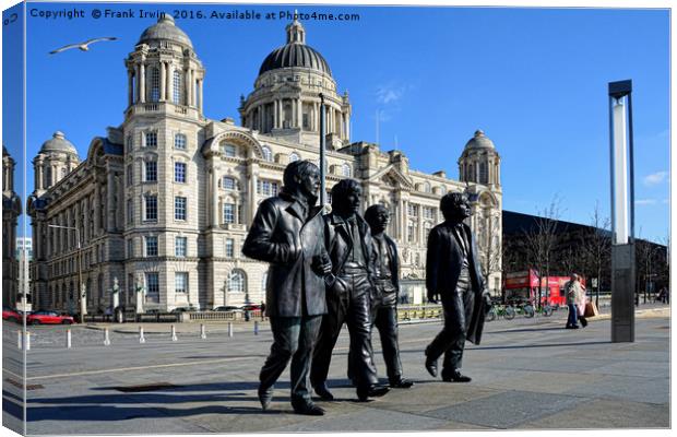 Statue of the Beatles at Liverpool's Pier Head. Canvas Print by Frank Irwin
