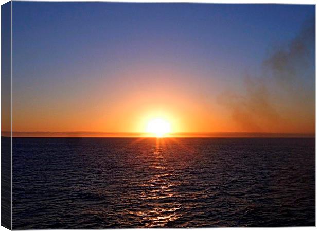 Sunset , Sea and Smoke Canvas Print by Bill Lighterness