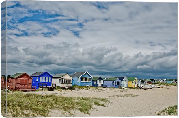 Mudeford spit beach huts Canvas Print by Dan Ward