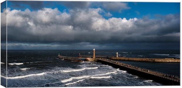 Stormy Skies over Whitby Pier Canvas Print by Dan Ward
