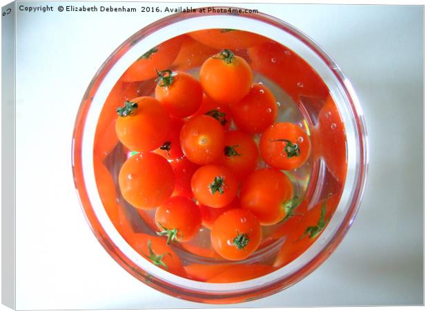 A bowl of baby tomatoes arranged in water. Canvas Print by Elizabeth Debenham