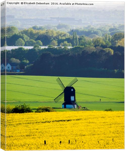 Windmill in a field of Yellow Oilseed Rape Canvas Print by Elizabeth Debenham