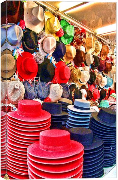 Traditional hats at Malaga feria Canvas Print by Adrian Wilkinson