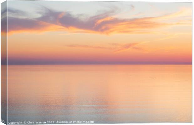 Sunset clouds over a calm sea Canvas Print by Chris Warren