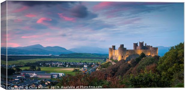 Harlech Castle at twilight with a pink sky sunset Canvas Print by Chris Warren