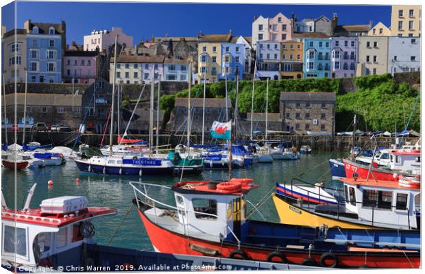 Welsh flag on a boat flying in Tenby harbour Canvas Print by Chris Warren