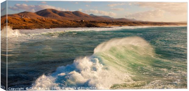Wind blowing the surf at El Cotillo Fuerteventura  Canvas Print by Chris Warren