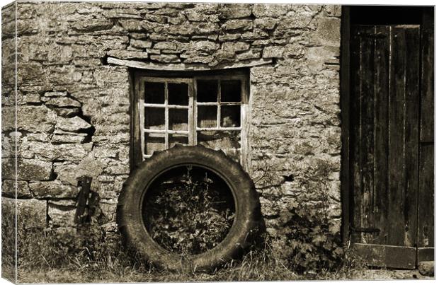 Old tractor wheel. Canvas Print by Andrew chittock