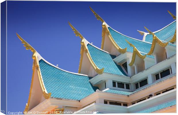 The roof of Wat Pa Phu kon  Canvas Print by Jim O'Donnell