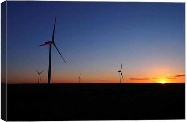  Wind turbines at sunset Canvas Print by Gerald Robinson