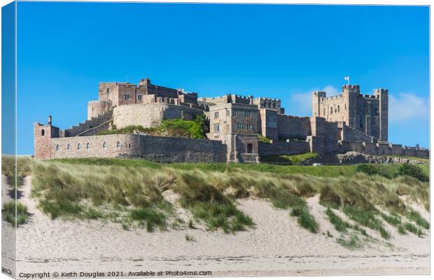 Bamburgh Castle from the beach Canvas Print by Keith Douglas