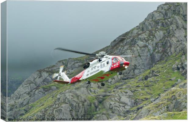 HM Coastguard Rescue Helicopter in Snowdonia Canvas Print by Keith Douglas