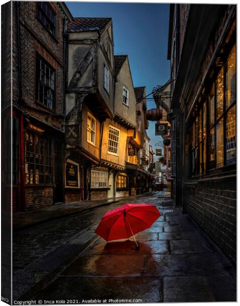 Red Umbrella On The Pavement Of The Shambles Canvas Print by Inca Kala