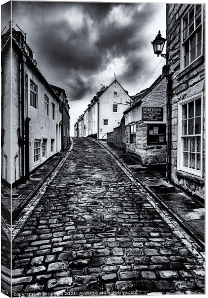 Whitby's Cobbled Streets and Fortune's Kipper House Canvas Print by Inca Kala